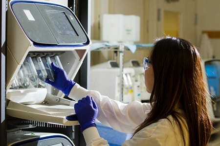 national-cancer-institute-GcrSgHDrniY-unsplash A researcher working in a lab